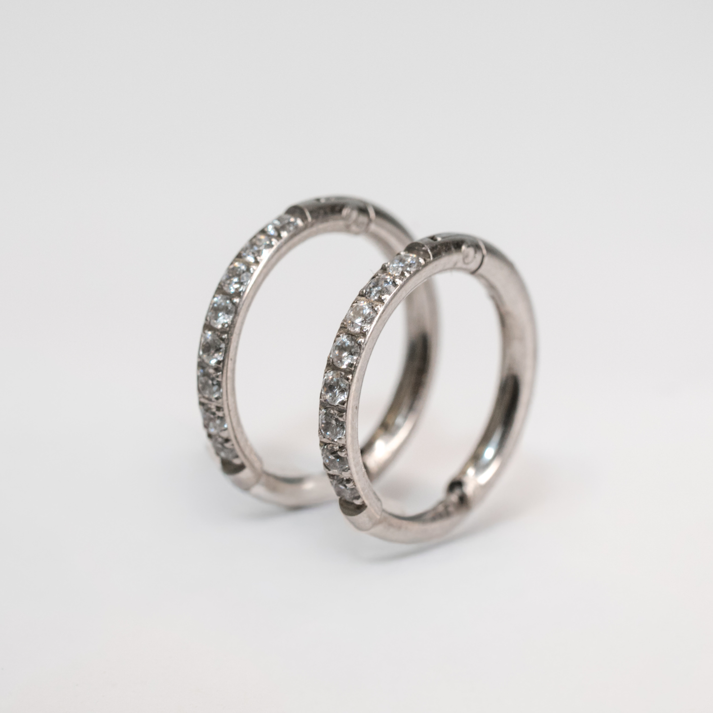Éclat Hoops silver crystal huggie earrings with sleek, polished finish