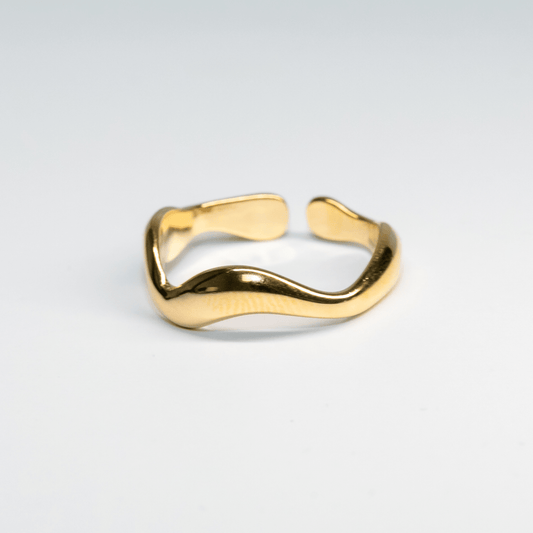 Gold Waveform Ring with smooth organic curves reflecting light