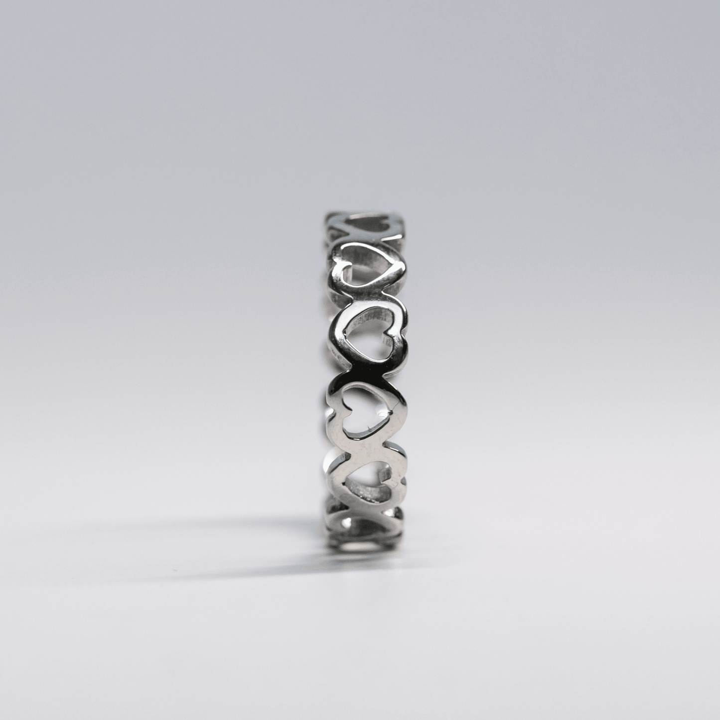 Silver Amour Band Ring with Open-Heart Design and Polished Finish