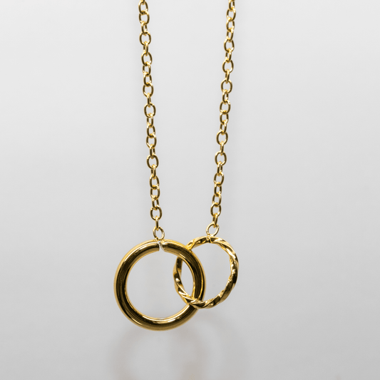 Eternal Links Necklace in gold with two interlocking circles symbolizing connection and harmony