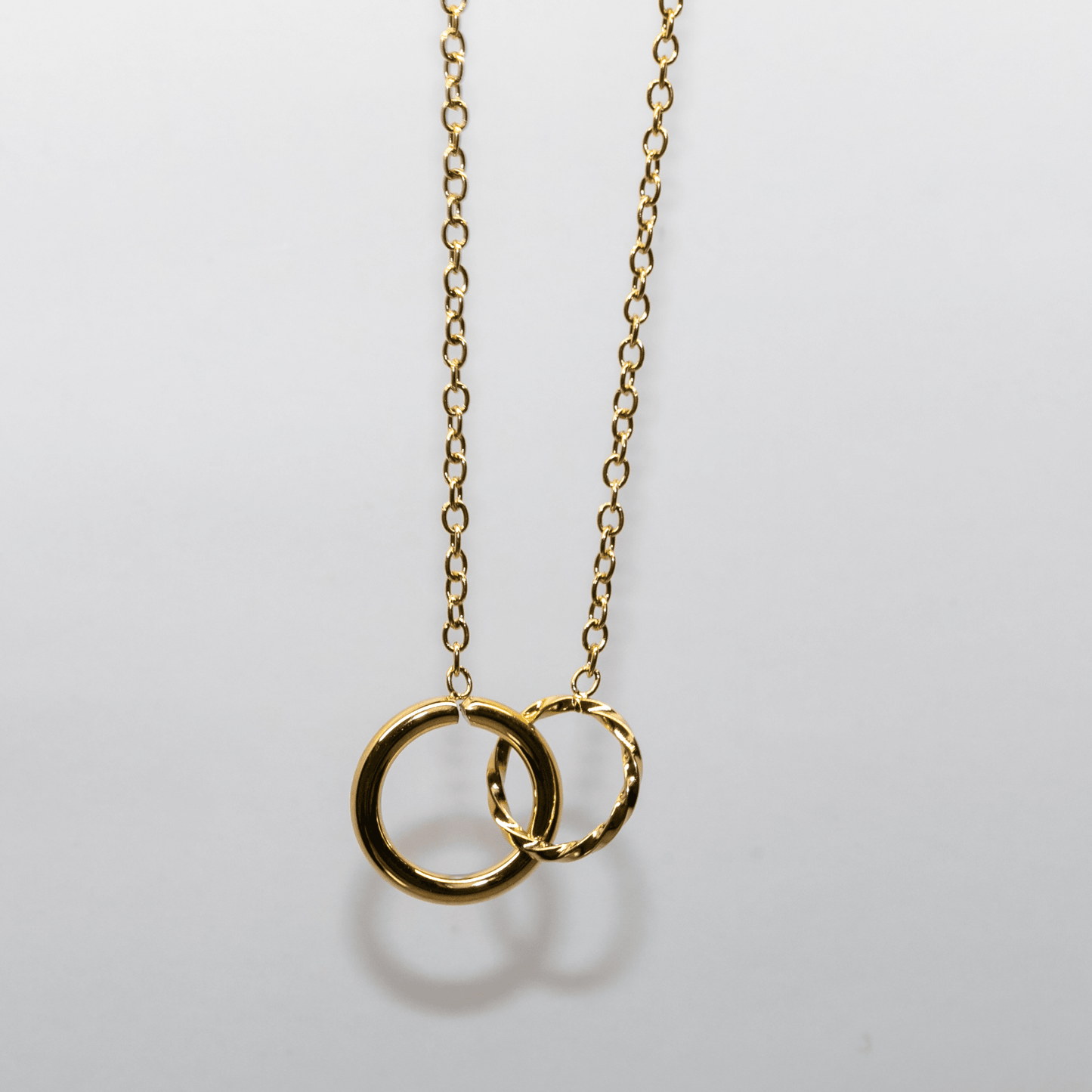 Eternal Links Necklace in gold with two interlocking circles symbolizing connection and harmony