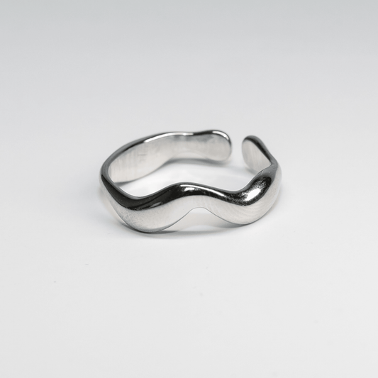 Silver Waveform ring with fluid shape and soft reflective surface