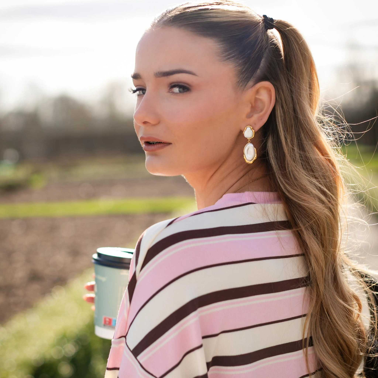 Callista Pearl Drops gold earrings with luminous pearls and organic curves