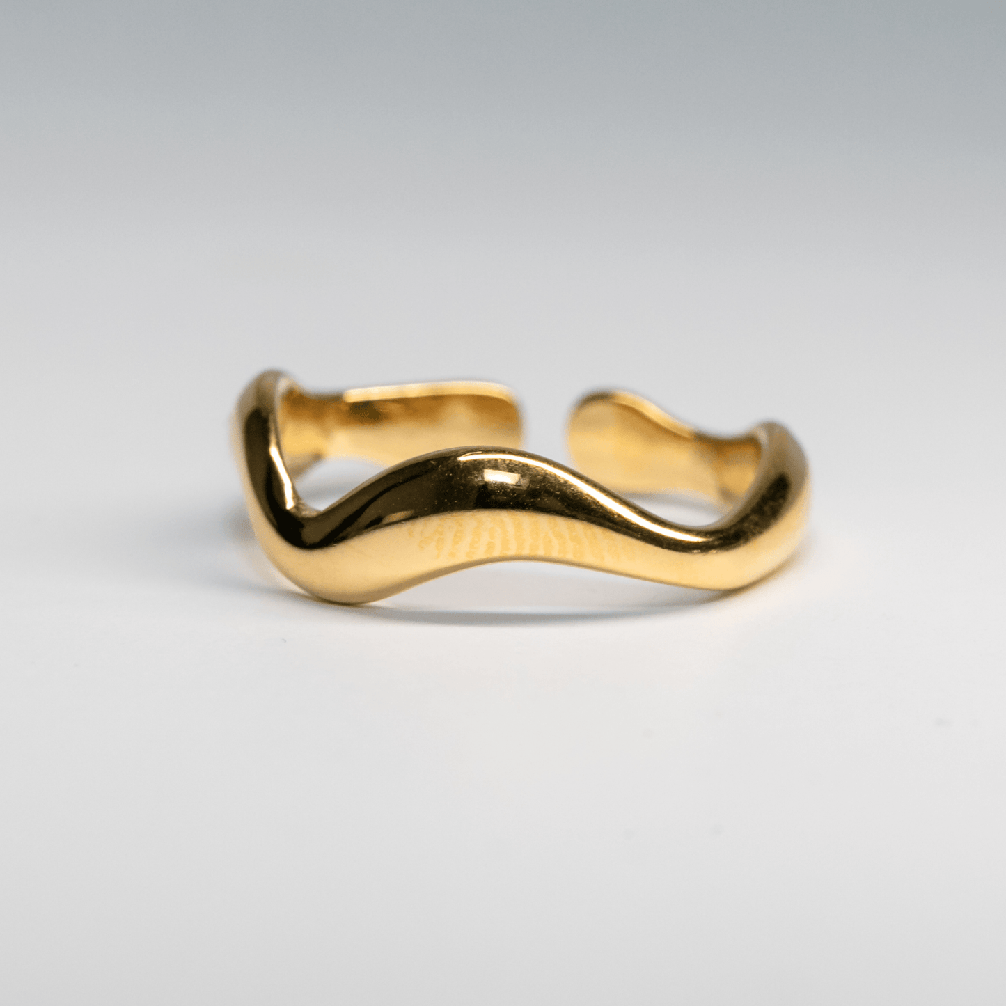 Gold Waveform Ring with smooth organic curves reflecting light