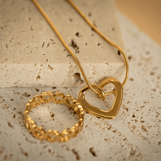 Gold Unity Heart Necklace with smooth sculptural curve and modern romantic design