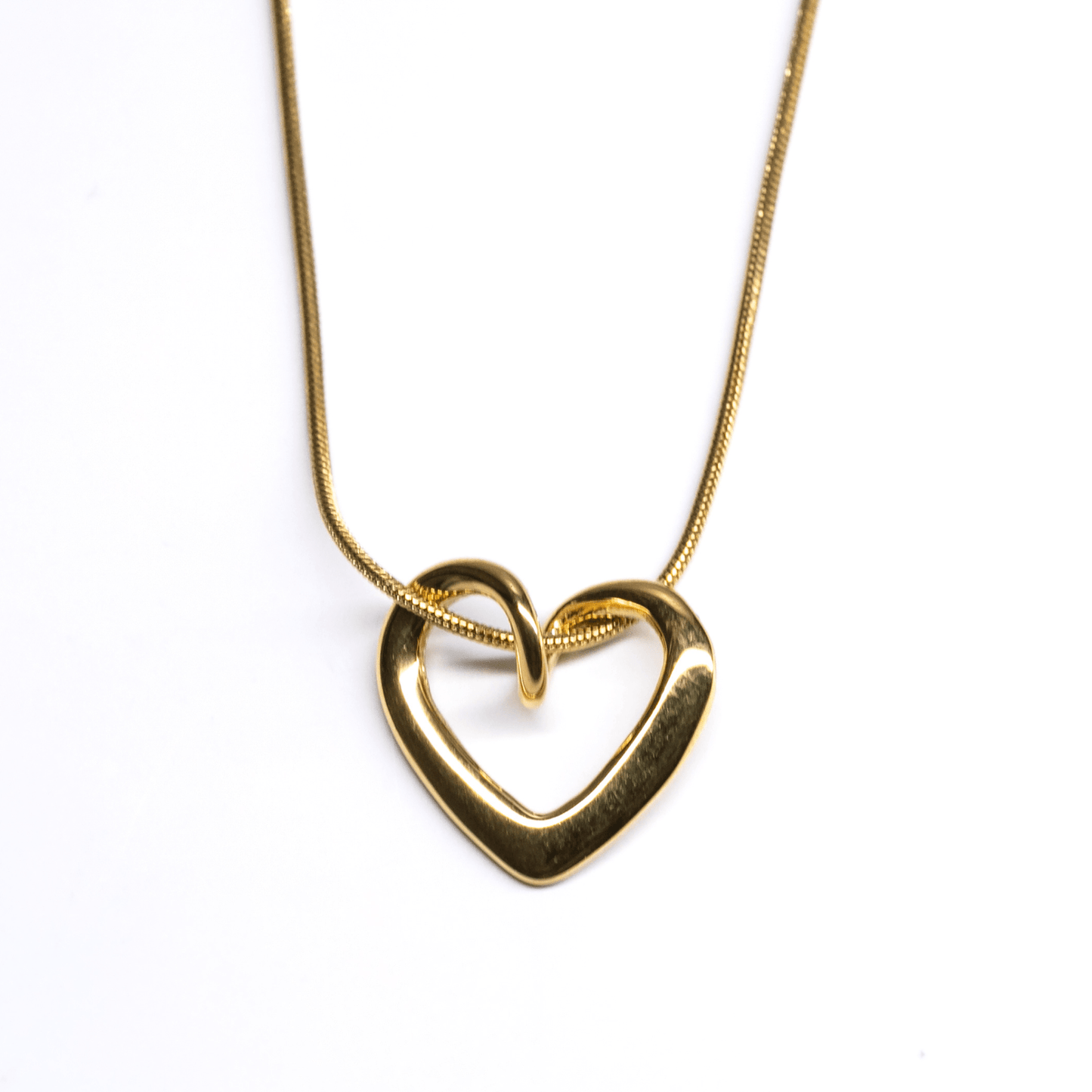 Gold Unity Heart Necklace with smooth sculptural curve and modern romantic design