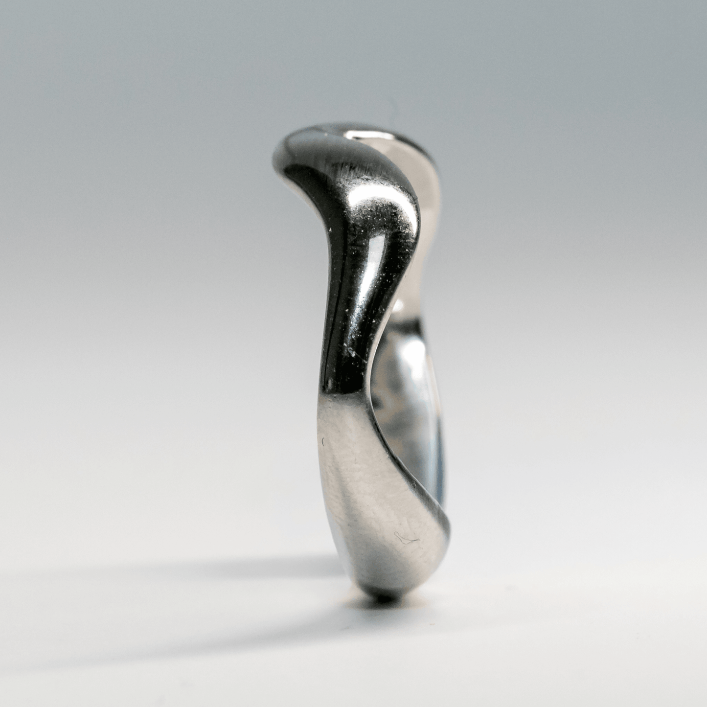 Silver Waveform ring with fluid shape and reflective surface