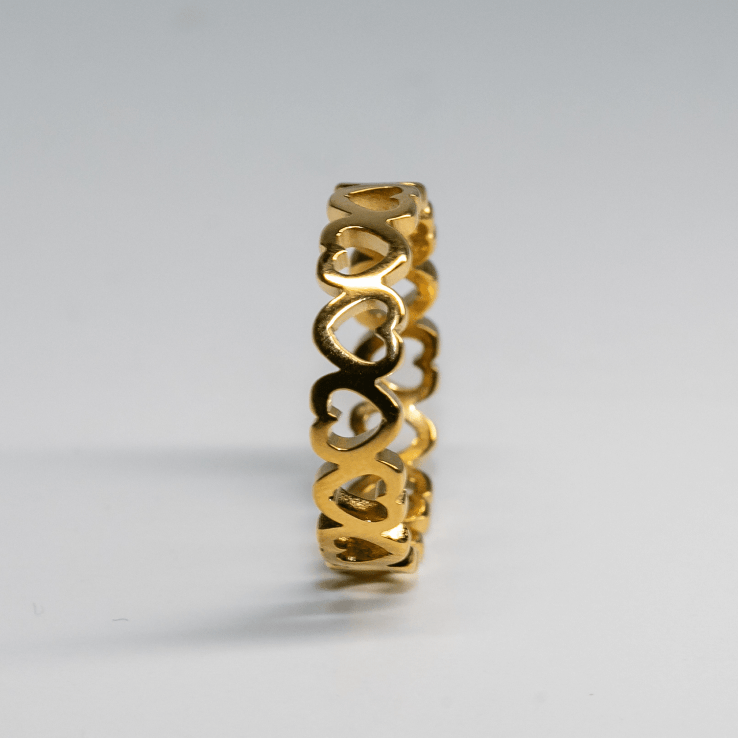 Gold Amour Band Ring with open heart cutout design symbolizing love and connection