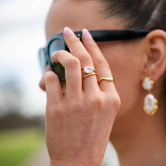 Gold Waveform Ring with smooth organic curves reflecting light