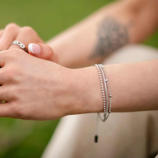 Liora Luxe Bracelet in silver with layered chains and crystal details reflecting light elegantly