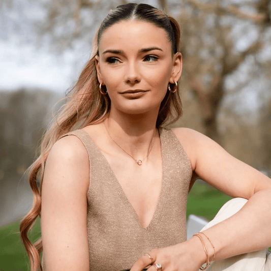 Gold Vera Twist Hoops with twisted, sculpted design and subtle shine