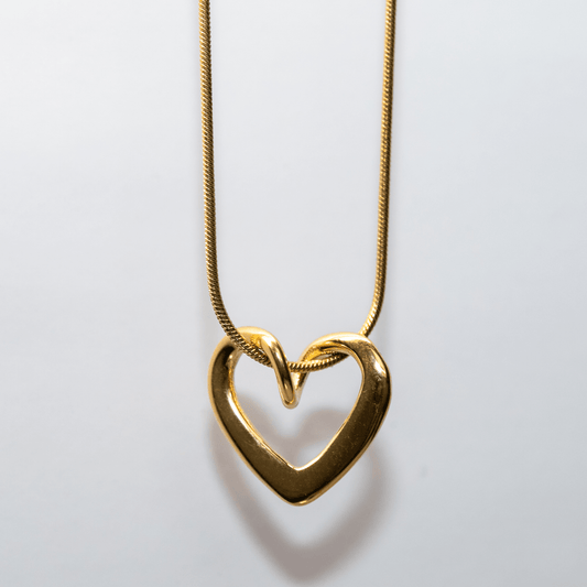Gold Unity Heart Necklace with smooth sculptural curve and modern romantic design